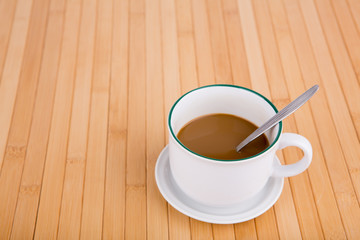 Coffee cup on the wooden table