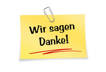 Gelber Notizzettel mit Büroklammer - Wir sagen Danke!