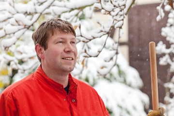 Portrait of  young man during snowfall