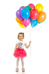 Fototapeta na wymiar Happy little girl with color balloons
