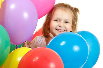 Fototapeta na wymiar Happy little girl with color balloon isolated on white