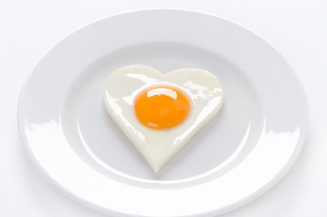 heart shaped egg on a plate
