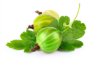 Two red gooseberries with green leaves isolated