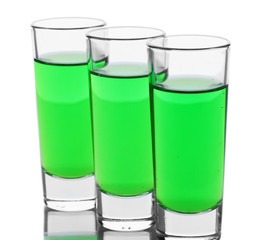 three glasses of absinthe isolated on white