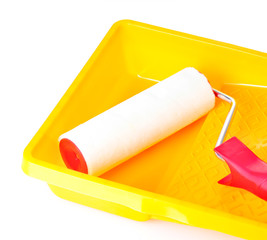 Paint roller with tray isolated on white close-up