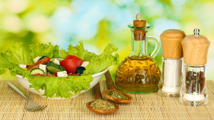 tasty greek salad on bright green background