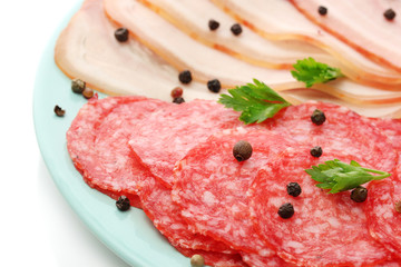 tasty bacon and sausage with spices on plate, isolated on white