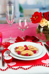 Table setting in honor of Valentine's Day on room background