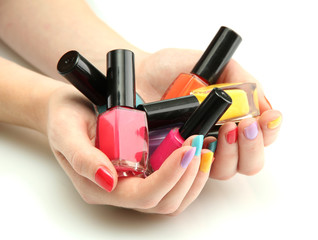 woman hands with nail polishes isolated on white