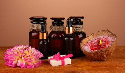 ingredients for soap making on brown background
