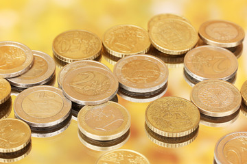 euro coins on color background