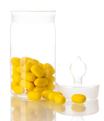 Transparent bottle with pills isolated on white