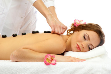 beautiful young woman in spa salon getting massage with spa