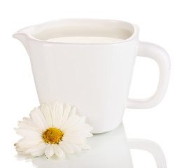 Jug with delicate cream isolated on white