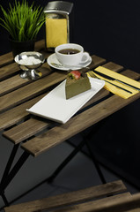 Coffee, cake, table set fork knife and flower