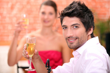 Couple on a date drinking champagne.