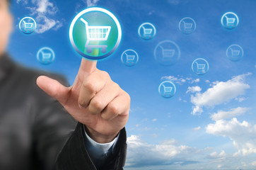 Businessman pressing on cart button