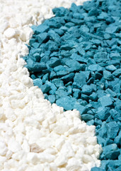 A closeup of colorful white and blue stones sand