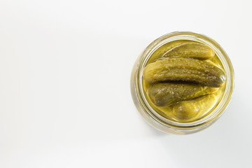 Pickled gherkins in glass jar