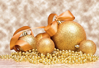 Golden Christmas spheres with bow
