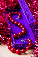 Red beads in lilac box