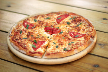 pizza on a wooden plate