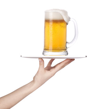 Hand Holding A Silver Serving Tray With  Beer