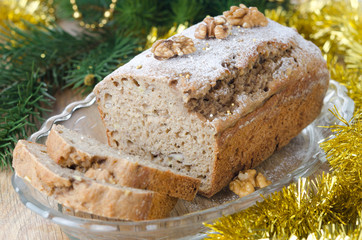 Christmas Banana cake with walnut dusted with icing sugar