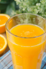 Glass of orange juice close up
