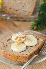 Slice of Christmas cake with banana walnut decorated slices of b