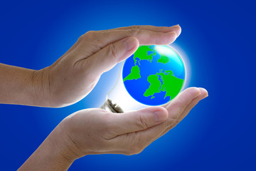the world in light bulb on the hand