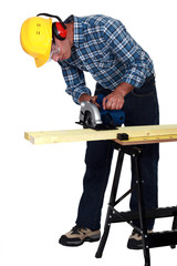 craftsman cutting a board