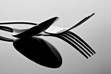 Fork and spoon with reflection. - 47059251