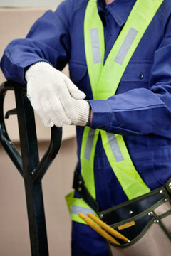 Midsection Of Young Foreman In Protective Clothing