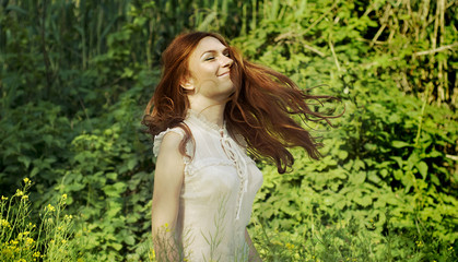 beautiful girl in spring green garden