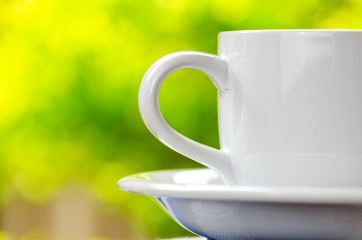 Cup of tea on nature background