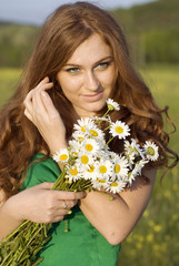 red-haired girl is walking in the spring