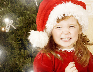 Baby girl under the Christmas tree