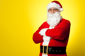 Saint Nick posing confidently against yellow background