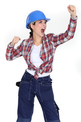 Female builder punching air