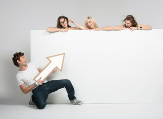 Young man pointing at advert