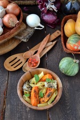 pasta with pumkin into wood dish