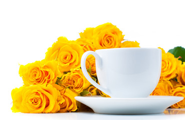 roses and white coffee cup