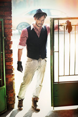 Fashion style man in the old wicket gate