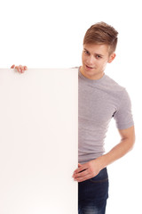 Portrait of young man with blank board