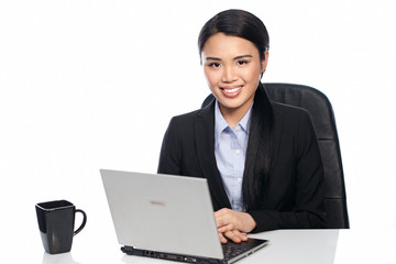 Successful Asian businesswoman at her desk