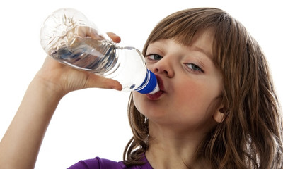 a little girl drinking water