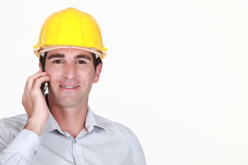 Architect stood making a call