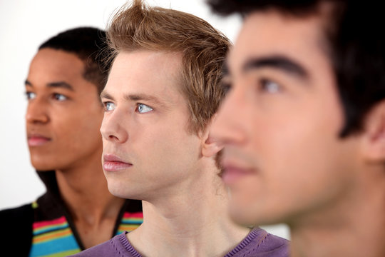 Three young men in profile
