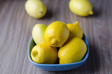 Lemons in the bowl on the table